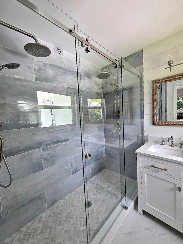 8994 SE Colony St, Hobe Sound, FL 33455 - bathroom with a shower stall, vanity, and healthy amount of natural light
