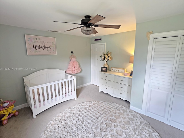 8994 SE Colony St, Hobe Sound, FL 33455 - bedroom featuring carpet, a nursery area, and ceiling fan