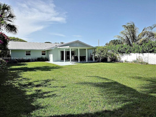 8994 SE Colony St, Hobe Sound, FL 33455 - back of property featuring a patio area and stucco siding