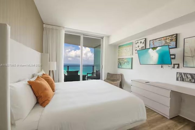 4111 S Ocean Dr Unit 2204, Hollywood, FL 33019 - bedroom with access to outside, wood finished floors, and expansive windows