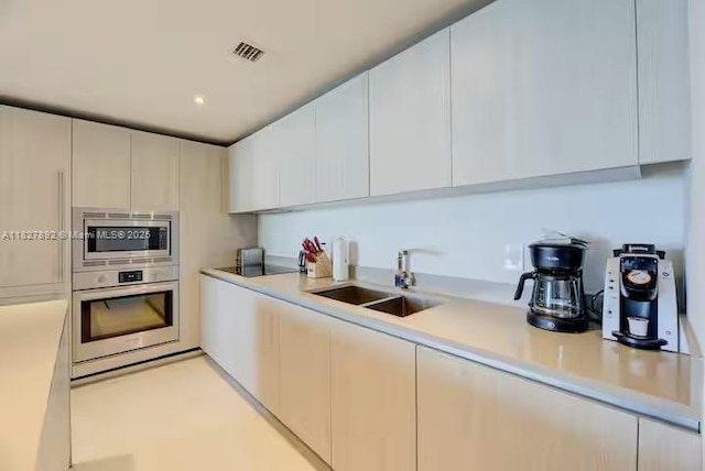 4111 S Ocean Dr Unit 2204, Hollywood, FL 33019 - kitchen featuring appliances with stainless steel finishes, light countertops, and modern cabinets