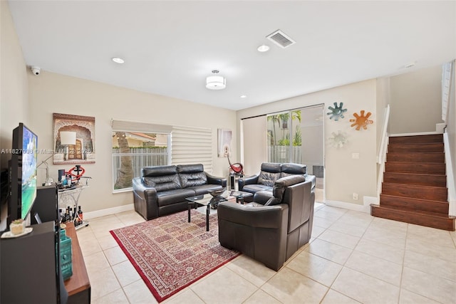 1115 SW 180th Ter, Pembroke Pines, FL 33029 - living area with light tile patterned flooring, stairs, and recessed lighting