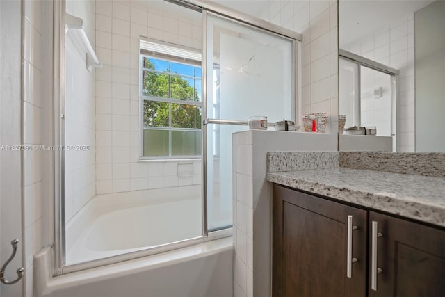 1115 SW 180th Ter, Pembroke Pines, FL 33029 - bathroom featuring vanity, bath / shower combo with glass door, and tile walls