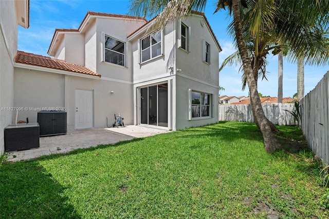 1115 SW 180th Ter, Pembroke Pines, FL 33029 - back of house with stucco siding, a fenced backyard, a tile roof, and a patio area