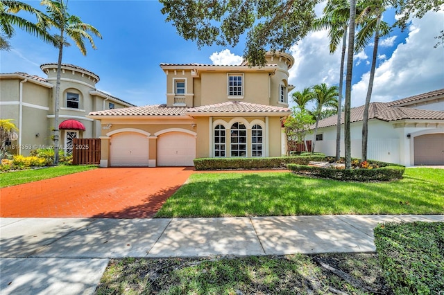 14141 SW 54th St, Miramar, FL 33027 - mediterranean / spanish-style house with stucco siding, an attached garage, driveway, a front yard, and a tiled roof