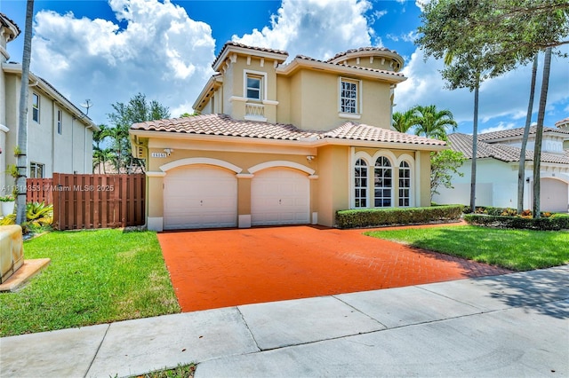 14141 SW 54th St, Miramar, FL 33027 - mediterranean / spanish home featuring stucco siding, a tiled roof, concrete driveway, and a garage
