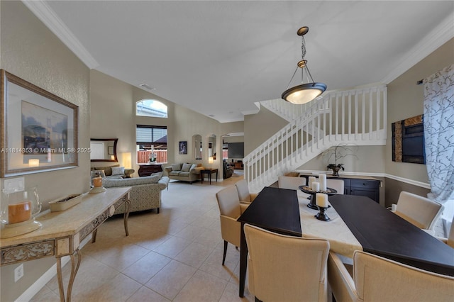 14141 SW 54th St, Miramar, FL 33027 - dining area featuring stairs, arched walkways, ornamental molding, light tile patterned flooring, and high vaulted ceiling
