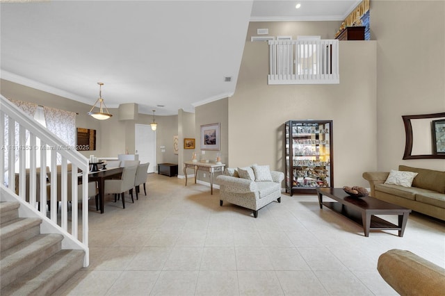 14141 SW 54th St, Miramar, FL 33027 - living room featuring stairway, light tile patterned floors, and crown molding