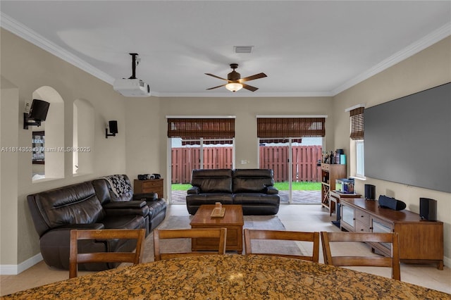 14141 SW 54th St, Miramar, FL 33027 - living room featuring crown molding, ceiling fan, arched walkways, and tile patterned flooring