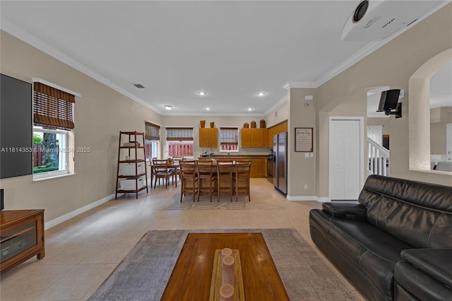 14141 SW 54th St, Miramar, FL 33027 - living room with light tile patterned flooring, arched walkways, crown molding, and recessed lighting