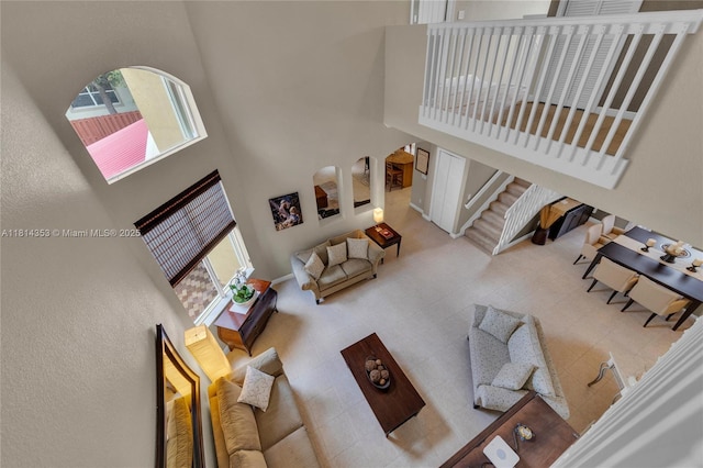 14141 SW 54th St, Miramar, FL 33027 - living area featuring a high ceiling, plenty of natural light, and stairway