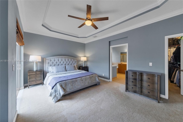 14141 SW 54th St, Miramar, FL 33027 - bedroom featuring a tray ceiling, a walk in closet, light colored carpet, ornamental molding, and a closet