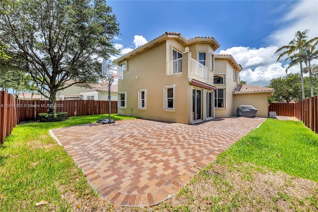 14141 SW 54th St, Miramar, FL 33027 - rear view of house with a tile roof, stucco siding, a fenced backyard, and a patio area