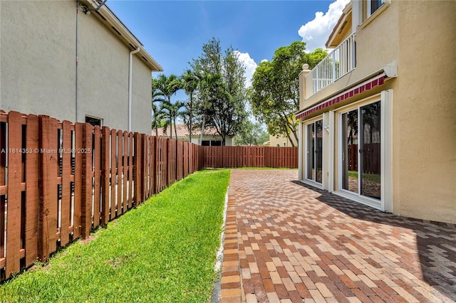 14141 SW 54th St, Miramar, FL 33027 - fenced backyard featuring a patio and a balcony