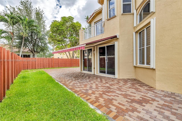14141 SW 54th St, Miramar, FL 33027 - fenced yard featuring a balcony and a patio
