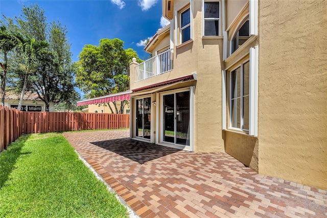 14141 SW 54th St, Miramar, FL 33027 - fenced backyard with a balcony and a patio area