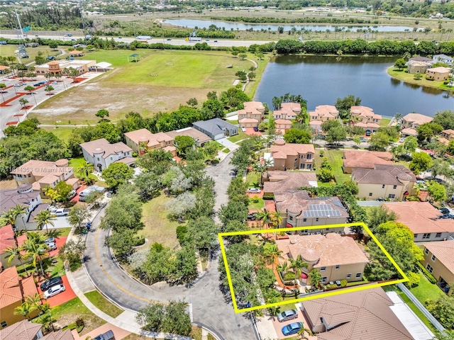 14141 SW 54th St, Miramar, FL 33027 - aerial perspective of suburban area with a large body of water and property parcel outlined