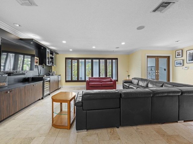 6005 SW 135th Ter, Pinecrest, FL 33156 - living room featuring wet bar, wine cooler, recessed lighting, french doors, and ornamental molding