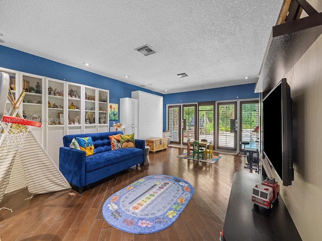 6005 SW 135th Ter, Pinecrest, FL 33156 - living room with hardwood / wood-style floors and a textured ceiling