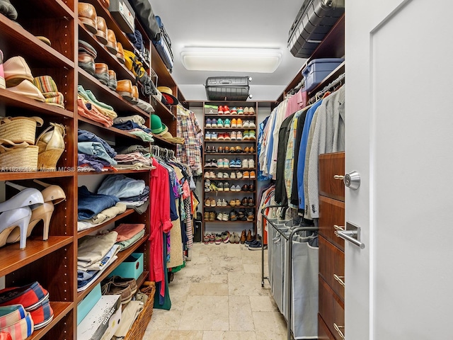 6005 SW 135th Ter, Pinecrest, FL 33156 - walk in closet featuring stone tile flooring