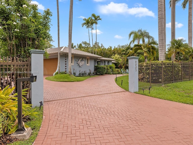 6005 SW 135th Ter, Pinecrest, FL 33156 - view of front of property with decorative driveway and stucco siding