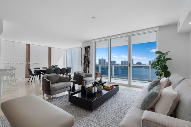 3301 NE 183rd St Unit 1803, Aventura, FL 33160 - living room featuring a wall of windows, light wood-style floors, and a water view