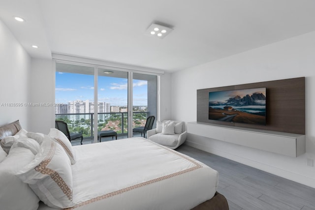 3301 NE 183rd St Unit 1803, Aventura, FL 33160 - bedroom featuring expansive windows, wood finished floors, and recessed lighting