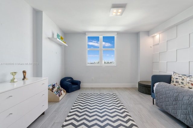 3301 NE 183rd St Unit 1803, Aventura, FL 33160 - bedroom with light wood-style floors and baseboards