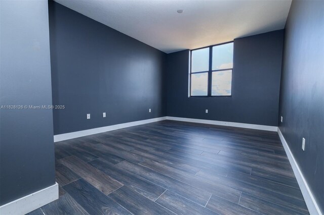 888 S Douglas Rd Unit Ph07, Coral Gables, FL 33134 - empty room featuring wood finished floors and baseboards