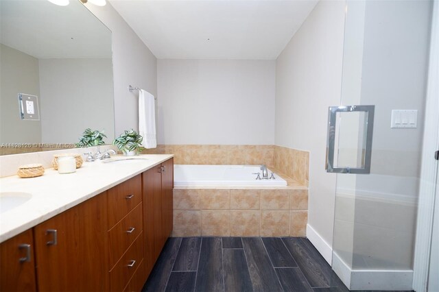 888 S Douglas Rd Unit Ph07, Coral Gables, FL 33134 - bathroom featuring wood finished floors, double vanity, and a bath