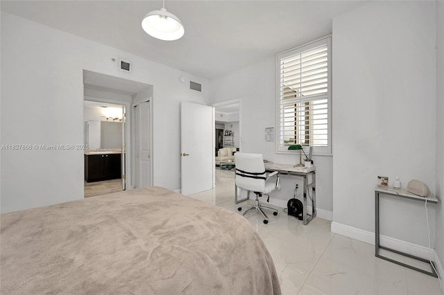 4100 Salzedo St Unit 515, Coral Gables, FL 33146 - bedroom featuring light marble finish flooring, an office area, and ensuite bath