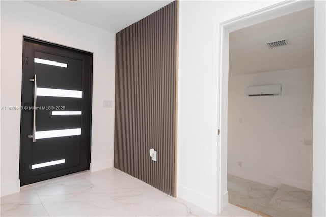 2181 SW 20th St, Miami, FL 33145 - foyer entrance with marble tiled flooring and a wall mounted air conditioner