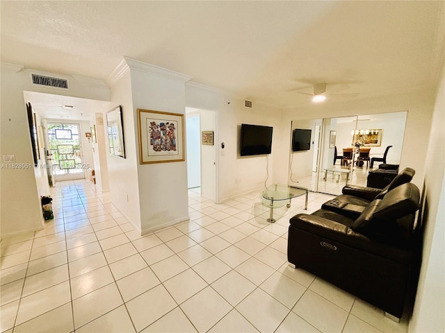 6080 Huntwick Ter Unit 305, Delray Beach, FL 33484 - living area featuring light tile patterned floors, ornamental molding, and ceiling fan