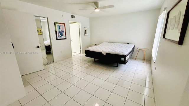 6080 Huntwick Ter Unit 305, Delray Beach, FL 33484 - bedroom with light tile patterned floors and a ceiling fan