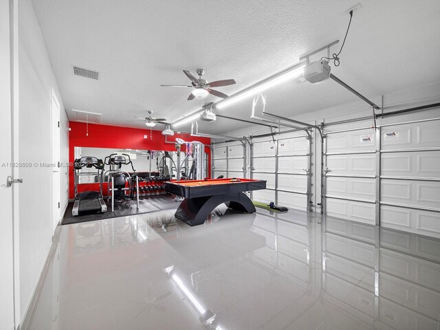 4501 SW 133rd Ave, Southwest Ranches, FL 33330 - garage with a garage door opener and a ceiling fan