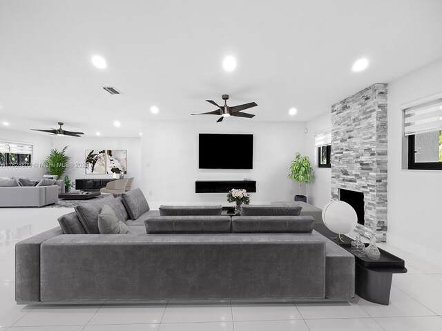 4501 SW 133rd Ave, Southwest Ranches, FL 33330 - tiled living room with a ceiling fan, plenty of natural light, recessed lighting, and a stone fireplace