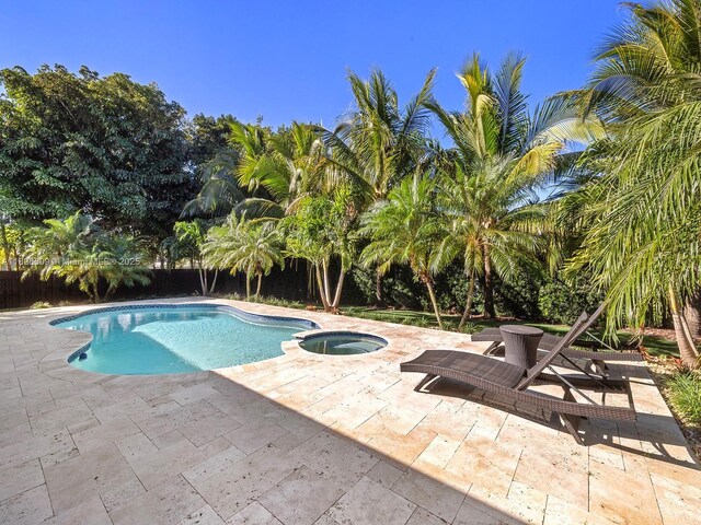 4501 SW 133rd Ave, Southwest Ranches, FL 33330 - view of swimming pool with a patio area, a fenced backyard, and a pool with connected hot tub