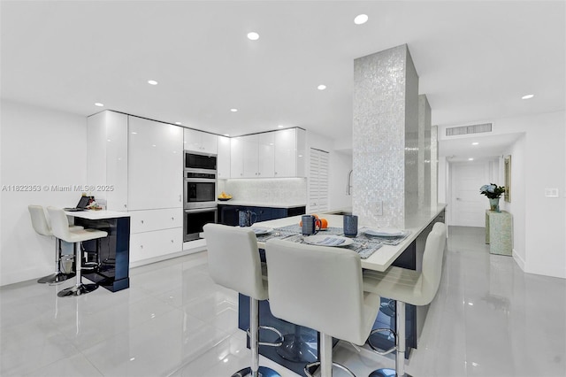 3900 Galt Ocean Dr Unit 506, Fort Lauderdale, FL 33308 - dining space with recessed lighting and light tile patterned floors