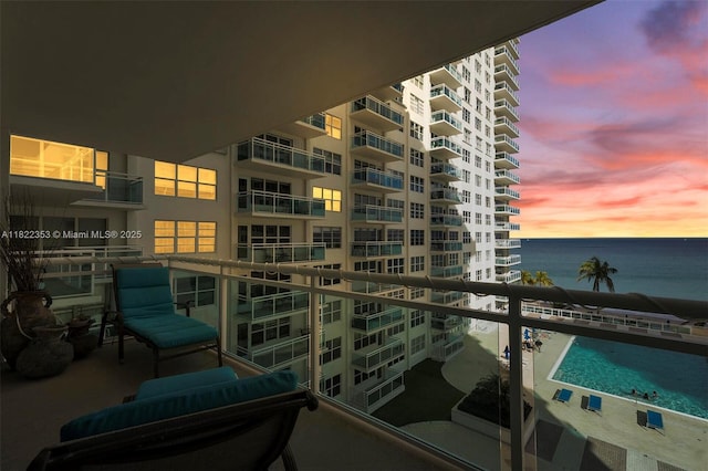3900 Galt Ocean Dr Unit 506, Fort Lauderdale, FL 33308 - balcony at dusk featuring a water view