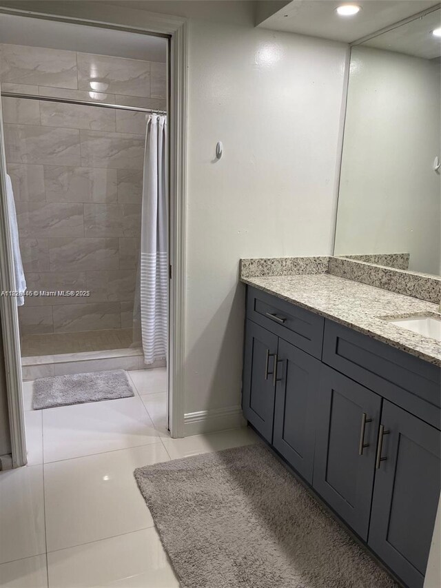 767 SE 22nd Dr, Homestead, FL 33033 - full bathroom with vanity, a tile shower, and tile patterned floors