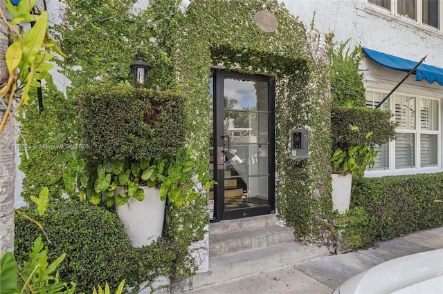 405 SW 29th Ct Unit 4A, Miami, FL 33135 - doorway to property with stucco siding