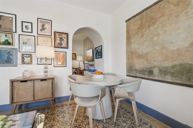 405 SW 29th Ct Unit 4A, Miami, FL 33135 - dining area with arched walkways and tile patterned floors