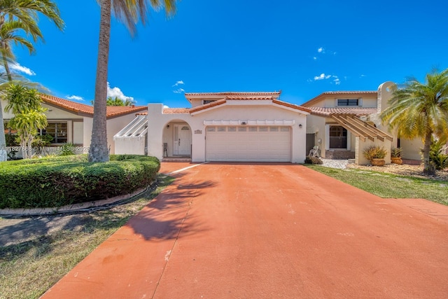 10000 SW 147th Ct, Miami, FL 33196 - mediterranean / spanish home featuring a garage, stucco siding, driveway, and a tile roof