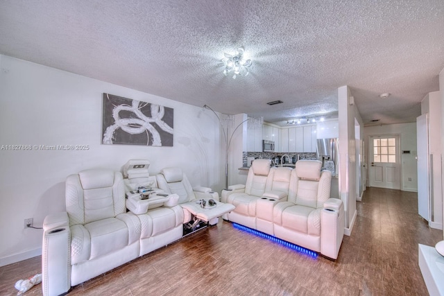 10000 SW 147th Ct, Miami, FL 33196 - living area with a textured ceiling and wood finished floors