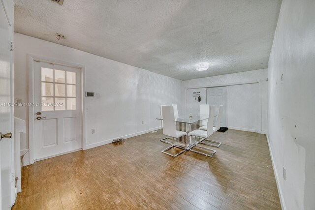 10000 SW 147th Ct, Miami, FL 33196 - dining space featuring a textured ceiling and wood finished floors