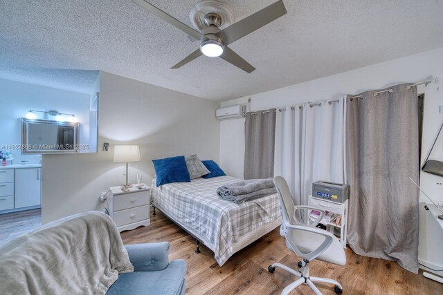 10000 SW 147th Ct, Miami, FL 33196 - bedroom with an AC wall unit, a textured ceiling, wood finished floors, and a ceiling fan