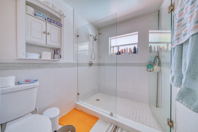 10000 SW 147th Ct, Miami, FL 33196 - bathroom featuring a tile shower and tile walls