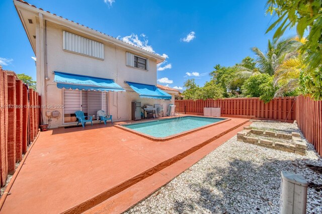 10000 SW 147th Ct, Miami, FL 33196 - view of pool with a fenced backyard, a patio area, and area for grilling