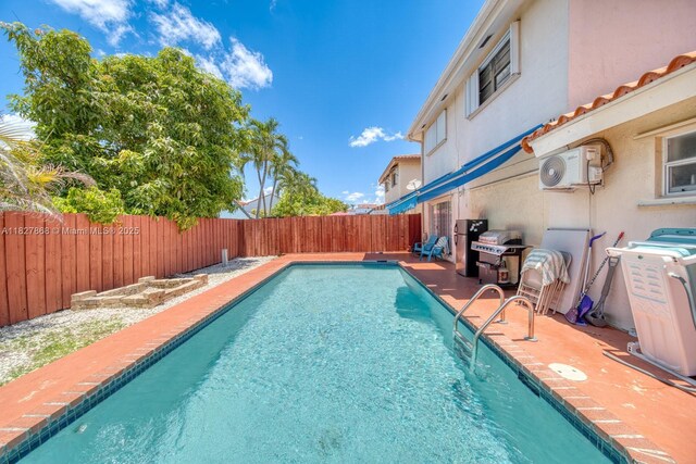 10000 SW 147th Ct, Miami, FL 33196 - view of swimming pool featuring a fenced backyard and a patio