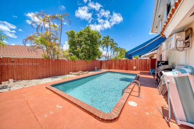 10000 SW 147th Ct, Miami, FL 33196 - view of swimming pool featuring a fenced backyard and a patio
